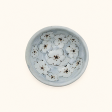 Spako Clay ceramic dish with floral pattern on a white background