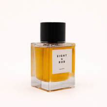 Perfume bottle labeled 'Eight & Bob' on a white background