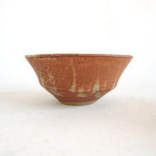 Ceramic bowl with a textured surface on a white background