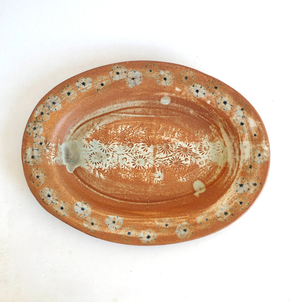 Ceramic plate with floral patterns on a white background