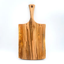 Wooden cutting board with a handle on a white background