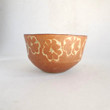 Ceramic bowl with floral patterns on a white background
