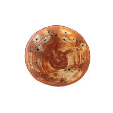 Round ceramic bowl with brown and blue floral pattern on a white background