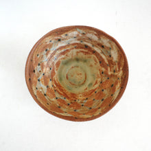 Ceramic bowl with a unique pattern on a white background