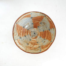 Ceramic bowl with a unique pattern on a white background
