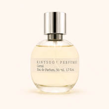 Perfume bottle with silver cap on a white background