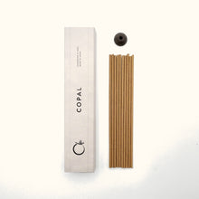Copal incense sticks with packaging on a white background