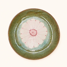 Ceramic plate with floral design on a white background