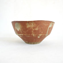 Brown ceramic bowl on a white background