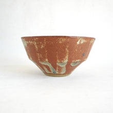 Ceramic bowl with textured surface on a white background