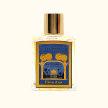 Perfume bottle with decorative label on a white background