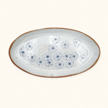 Ceramic plate with blue floral pattern on a white background