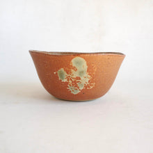 Ceramic bowl with floral design on a white background