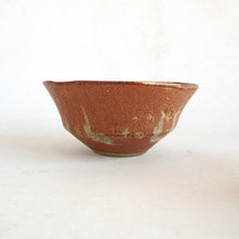 Brown ceramic bowl on a white background