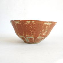 Ceramic bowl with textured surface on a white background
