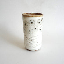 Spako Clay tumbler black line drawing of flowers and emboss pattern, white glaze