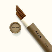 Incense sticks in a cardboard tube with 'Mystic Voyage' packaging on a white background
