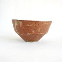 Brown ceramic bowl on a white background