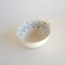 Cappuccino mug with geometric pattern on beige background