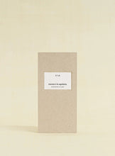 Beige box with a white label on a beige background