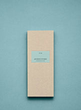 Beige box with a blue label on a light blue background