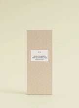 Beige product packaging with a label on a beige background