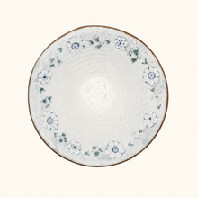 Ceramic bowl with floral patterns on a white background