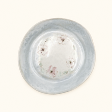 Decorative ceramic plate with floral patterns on a white background