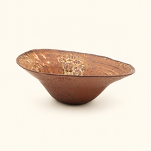 Bowl with textured surface on a white background