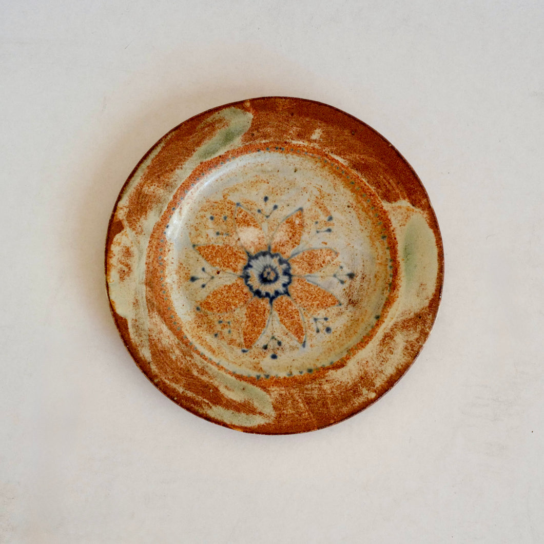 Ceramic plate with floral design on a white background