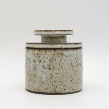 MH Ceramic Studio Speckled ceramic jar with a lid on a white background