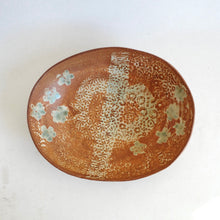 Ceramic plate with floral patterns on a white background