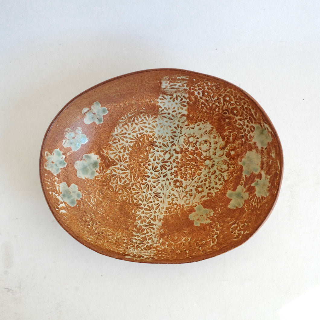 Ceramic plate with floral patterns on a white background