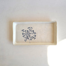 Rectangular ceramic dish with a blue floral pattern on a white background