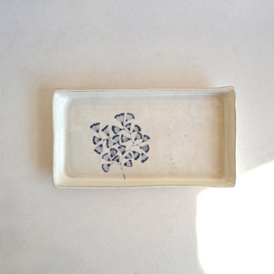 Rectangular ceramic dish with a blue floral pattern on a white background