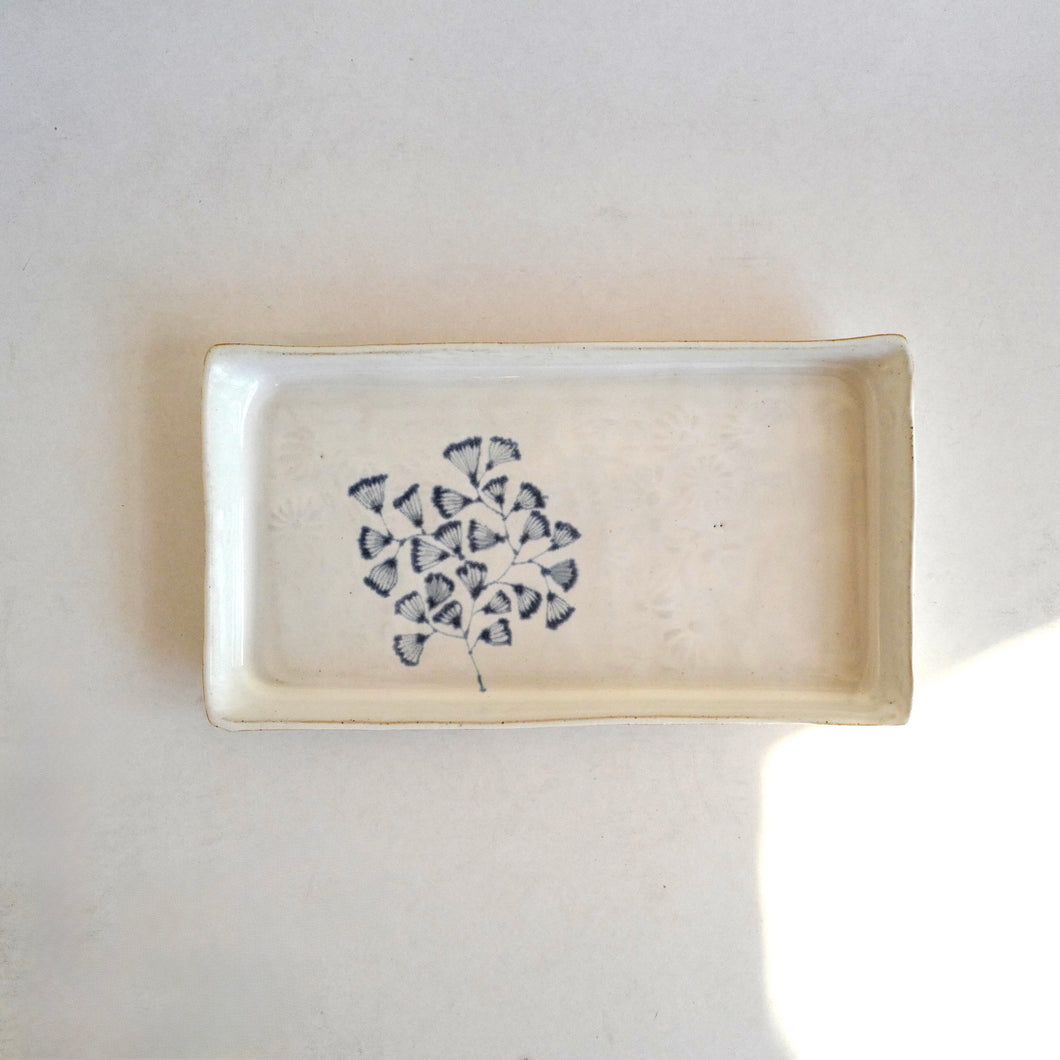 Rectangular ceramic dish with a blue floral pattern on a white background