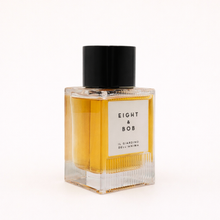 Perfume bottle with 'Eight & Bob' branding on a white background