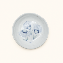 Spako Clay Small white ceramic dish with blue floral design on a white background