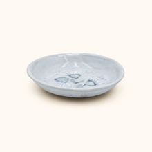 Spako Clay Small white ceramic dish with blue floral design on a white background