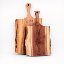 Two wooden cutting boards on a gray background 