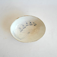 Ceramic bowl with floral design on a white background