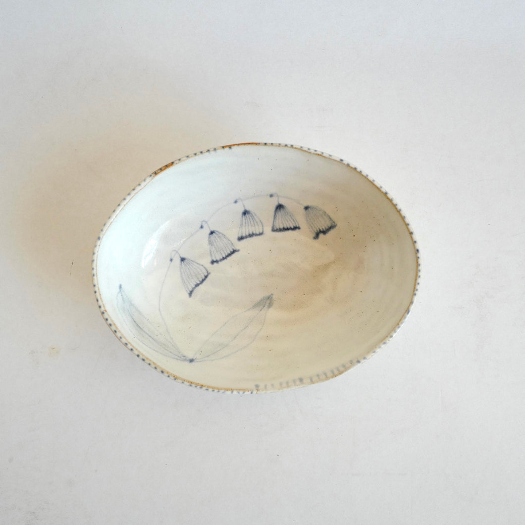 Ceramic bowl with floral design on a white background