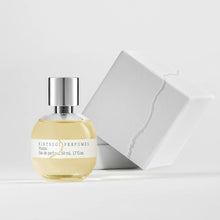 Perfume bottle with metal cap and box on white background