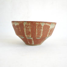 Ceramic bowl with textured surface on a white background