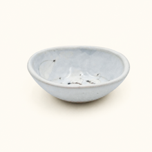 Spako Clay ceramic dish with floral pattern on a white background