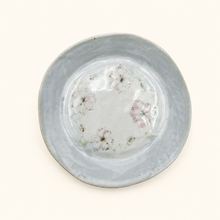 Ceramic plate with floral pattern on a light background