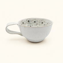 Spako Clay cappuccino mug with blue floral patterns on a white background