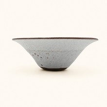 Ceramic bowl with a textured surface on a white background