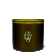 Green candle jar with a logo on a white background