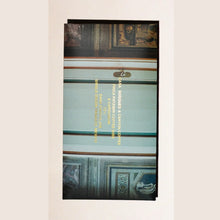 Chocolate bar packaging of picture of doorway with gold type